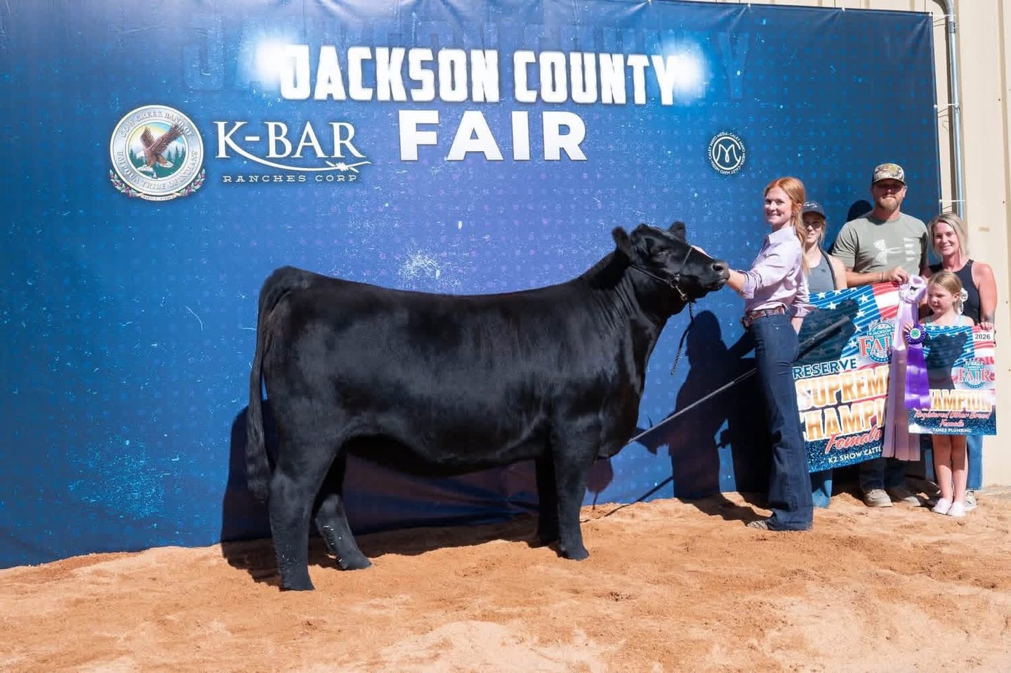 Paige Logan with the reserve supreme champion female at the 2026 Jackson County Fair, Good Times out of 906