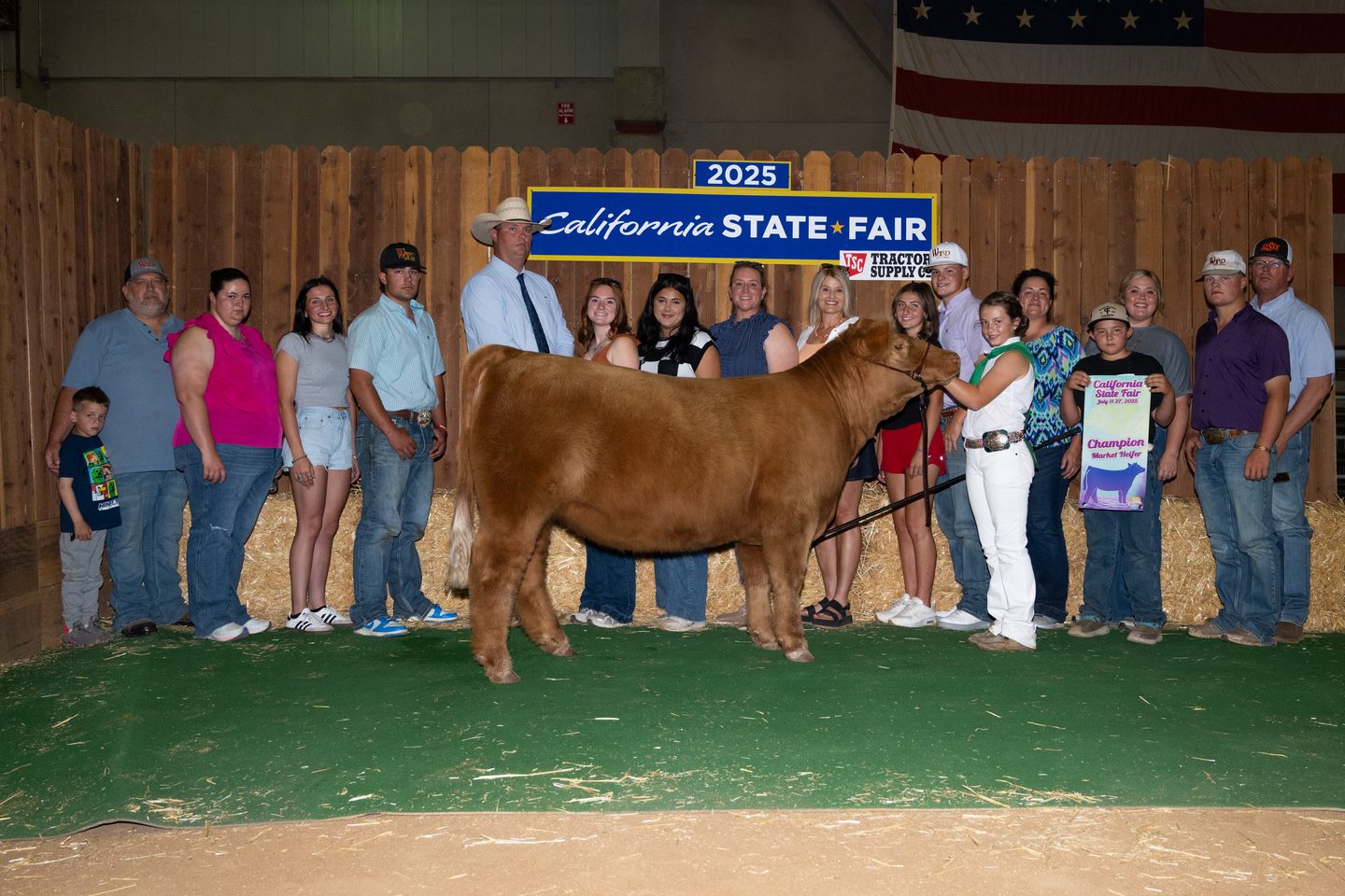 Avery Swallow with the champion market heifer at the 2025 California State Fair, sired by IGWT out of Marvel