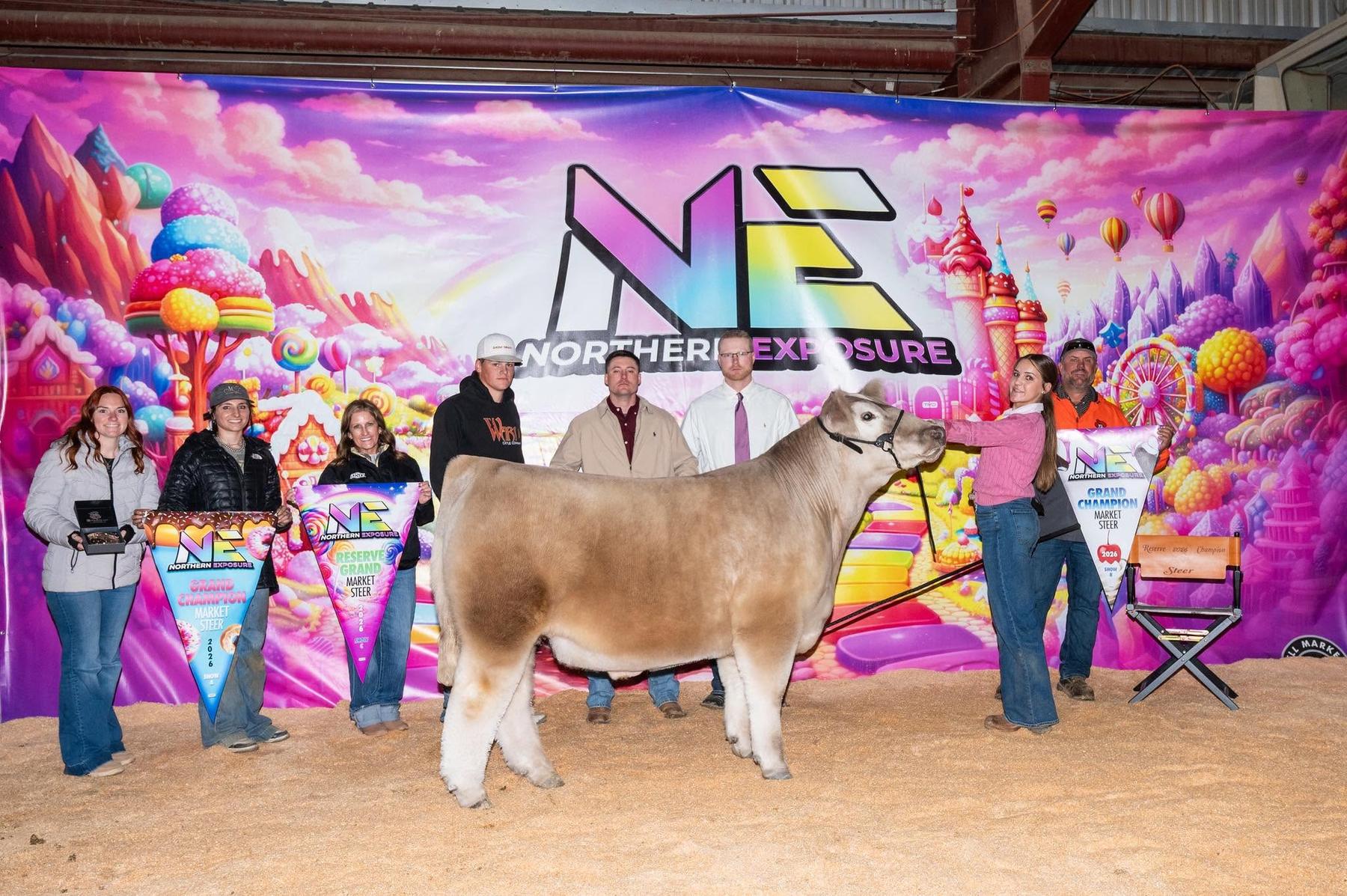 Georgia Nissen with the grand champion market steer at the 2026 Northern Exposure, sired by IGWT out of Marvel